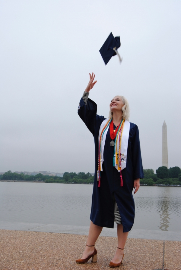 Marlee throwing her graduation cap in the air