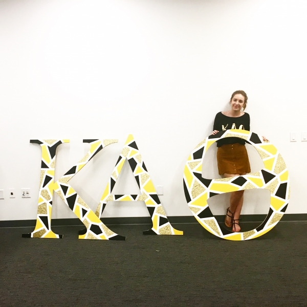 Catherine Williams in front of sign