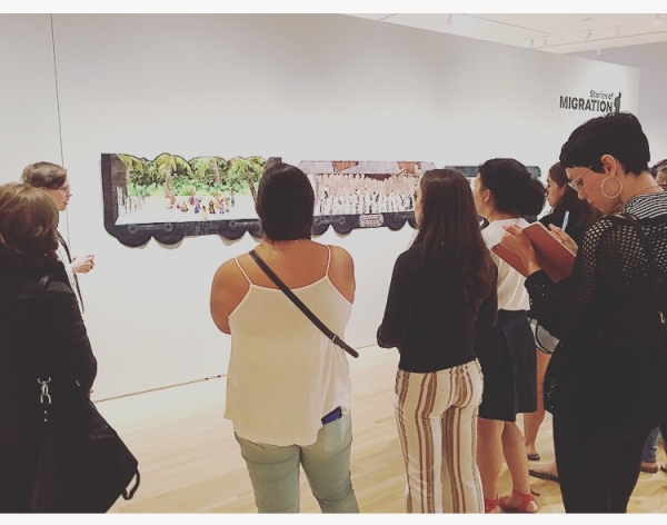 group observing display on museum