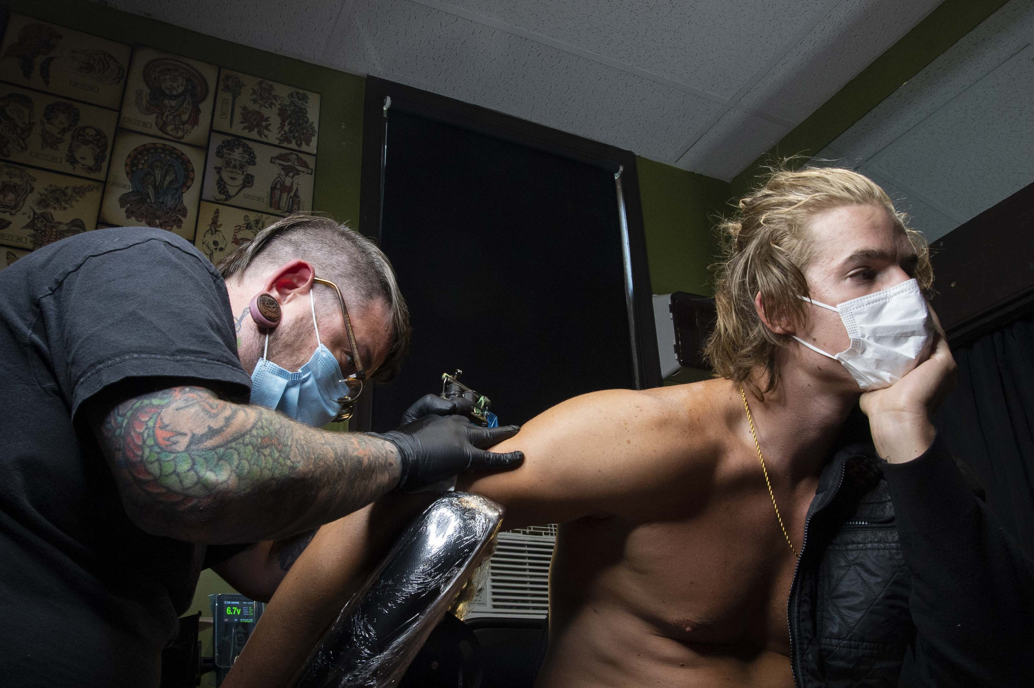 Shot for the Morning Call - a man getting a tattoo shortly after parlors reopened in summer 2020