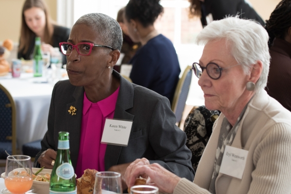 2 event goers eating a meal