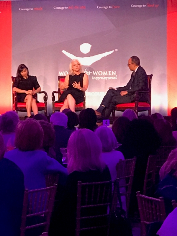 Three people sitting on stage talking