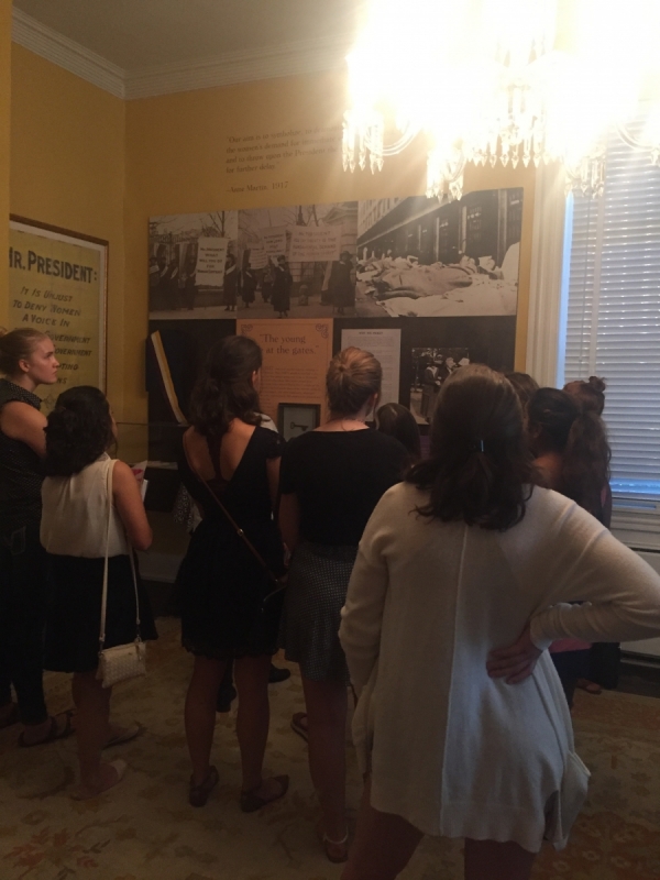 People looking at a display