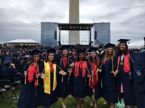 Adithi, Rebecca, and Claire in graduation gowns