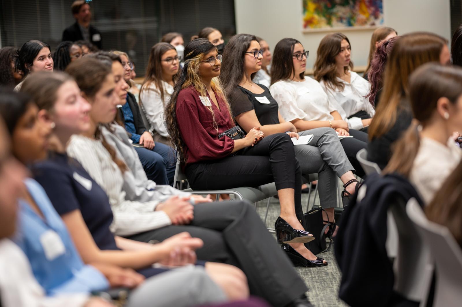 audience watching presenters