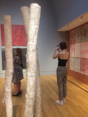 Person taking a picture of art